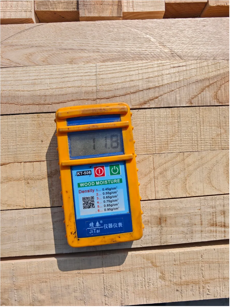 Moisture meter inspection on kiln-dried ash wood