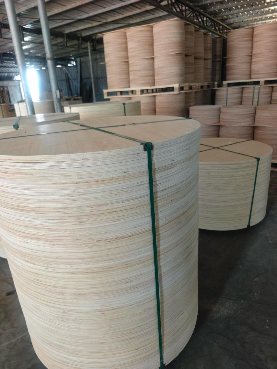 Plywood Cable Reel Flanges — Thin circular veneer sheets bundled with green straps
