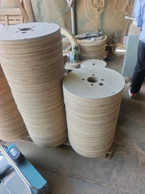 Plywood Cable Reel Flanges — Flange discs with center and drilled holes on pallets