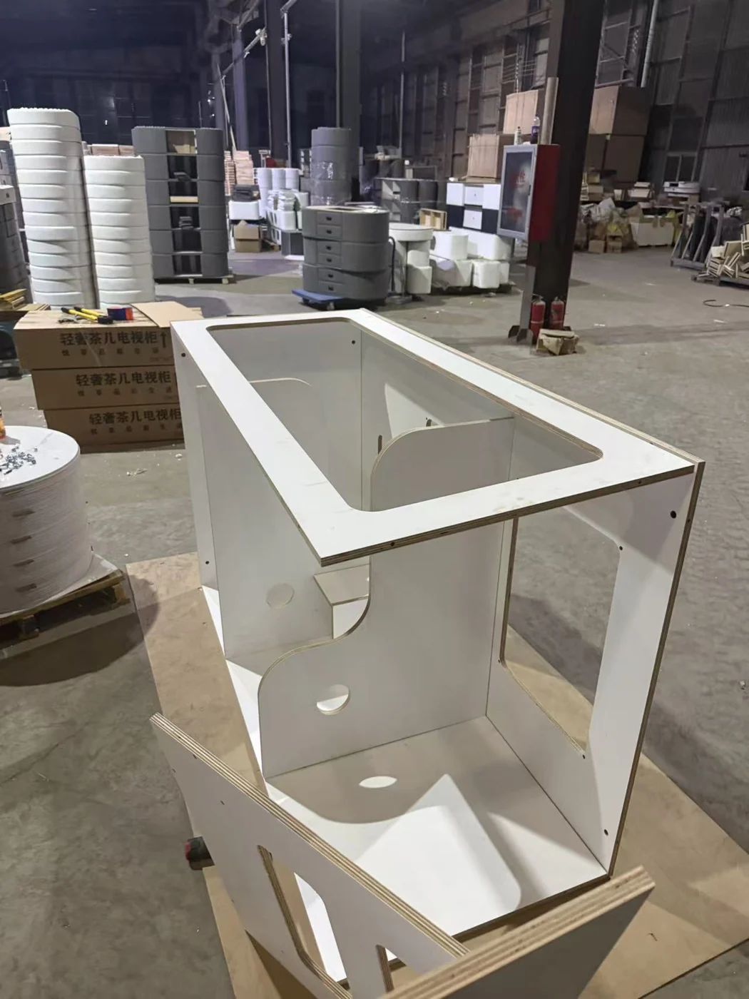 Real workshop prototype showing the open internal structure, partitions and CNC passages of a custom cat enclosure