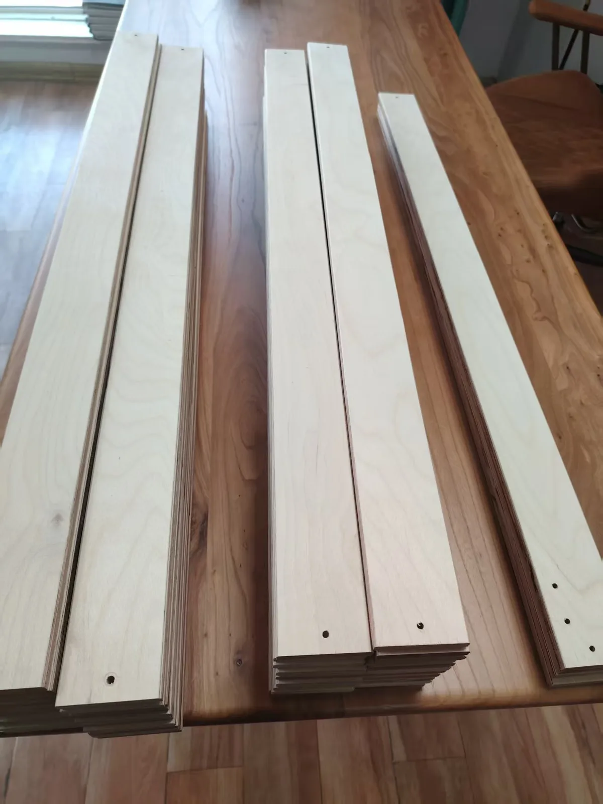 Birch LVL bed slats stacked for production