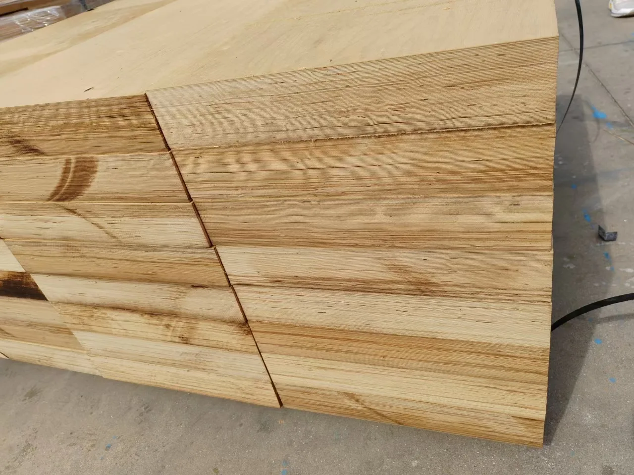Laminated veneer lumber stacked for supply