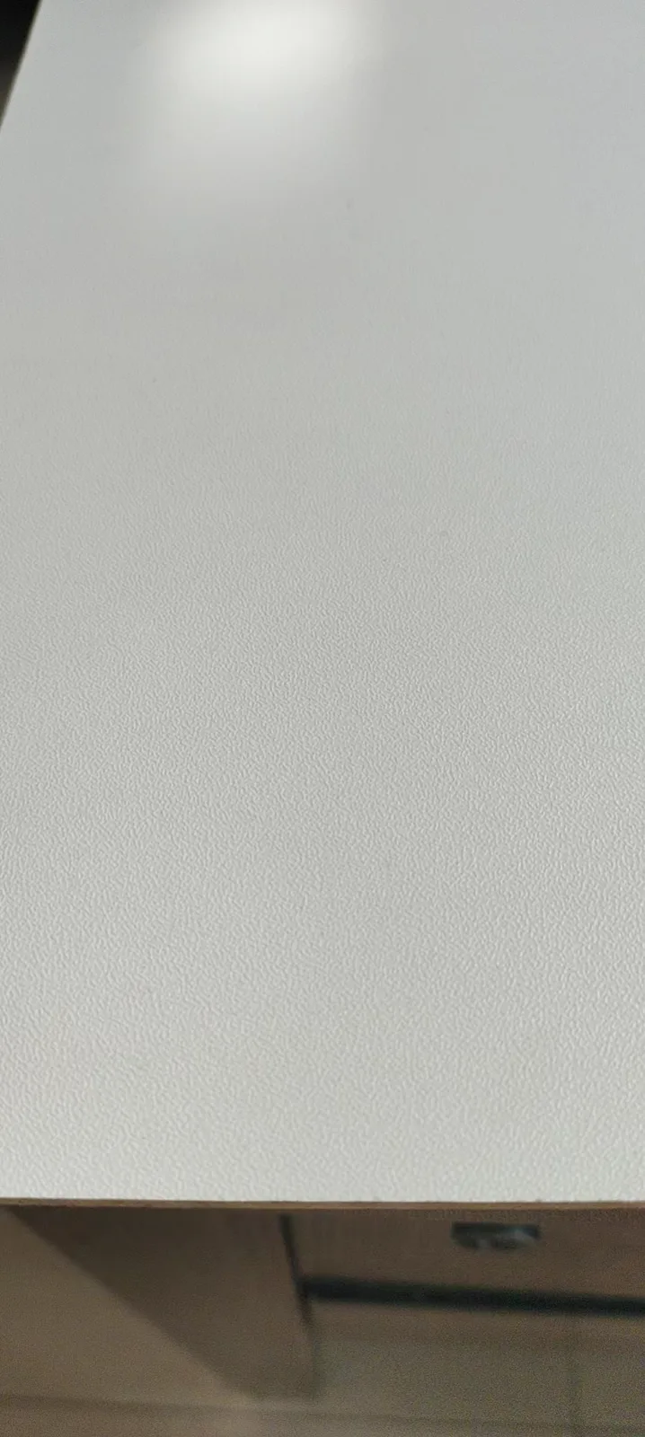 Melamine faced panel with wood-grain texture